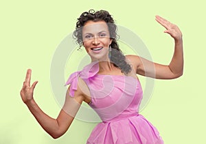 Pretty woman in pink puffy dress with bow push apart proposed text with hands, spreading her hands in front of she