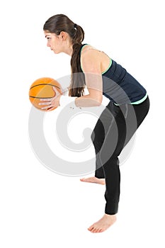 Pretty woman playing basketball, isolated over white