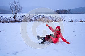 Pretty woman playing in snowfield