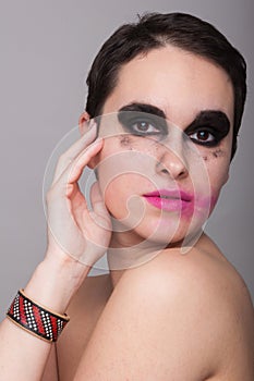 Pretty woman posing with smeared makeup