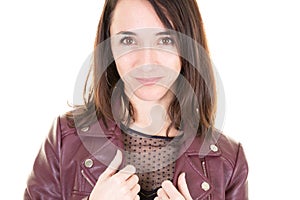 Pretty woman in red leather jacket on white background hands on collar