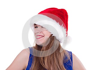 Pretty woman in red santa claus hat laughing