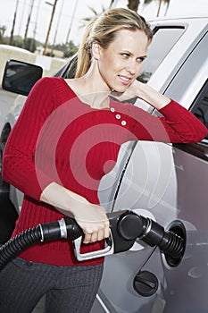 Pretty Woman Refueling Her Car