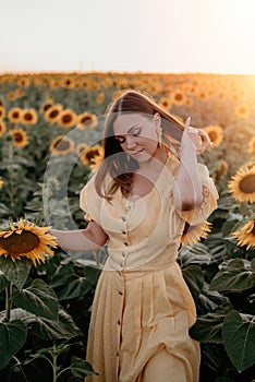 Pretty woman in retro dress posing in sunflowers field. Yellow colors, warm toning. Vintage timeless fashion, amazing