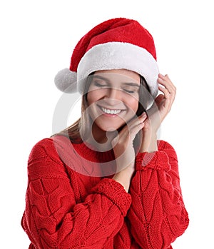 Pretty woman in Santa hat and red sweater on white background