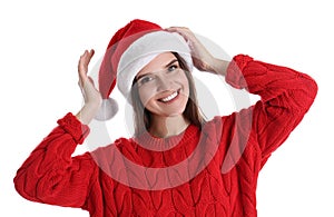 Pretty woman in Santa hat and red sweater on white background