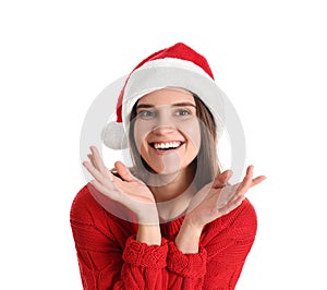 Pretty woman in Santa hat and red sweater on white background