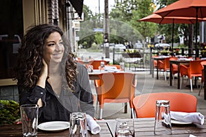 Pretty Woman Seated at Outdoor Cafe Bistro photo