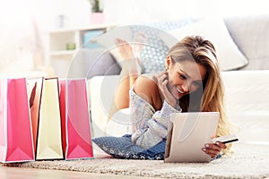 Pretty woman shopping online with credit card