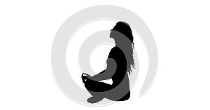 Pretty woman sitting in lotus pose silhouette