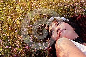 Pretty woman sleep on flowers garden.