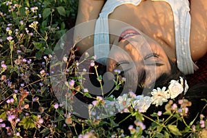 Pretty woman sleep on flowers garden.