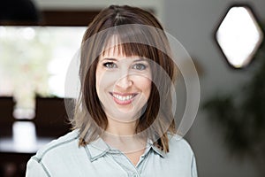 Of A Pretty Woman Smiling At The Camera At Home