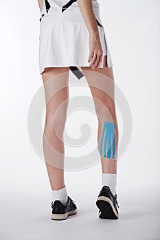 Pretty woman with sports taping on the body