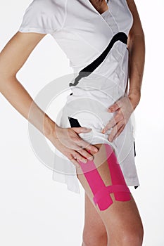 Pretty woman with sports taping on the body