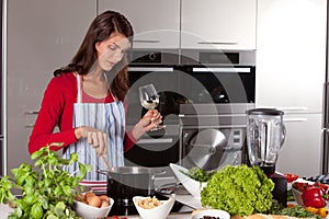 Pretty woman stirring in the pan
