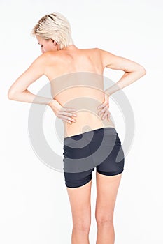 Pretty woman suffering from back pain