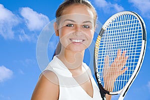 Pretty woman with a tennis racket