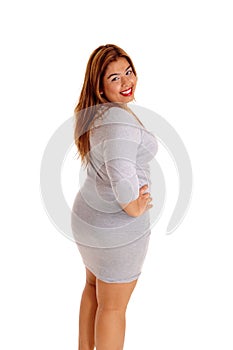 Pretty woman in tight gray dress.