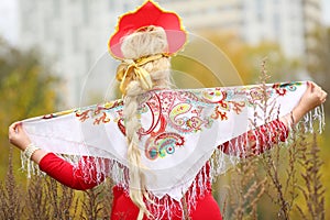 Pretty woman in traditional russian kokoshnik with photo