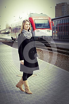 Pretty woman waitting a train