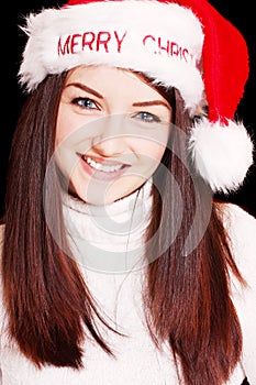 Pretty woman wearing santa hat