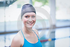 Pretty woman wearing swim cap