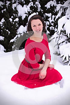 Pretty woman in winter with red dress