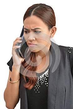 Pretty woman worried by mobile phone