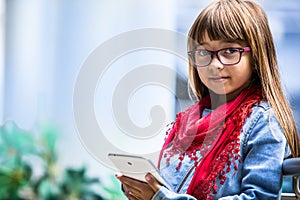 Pretty youn girl with tablet.