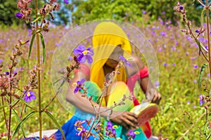 pretty young african woman eating watermelon outside