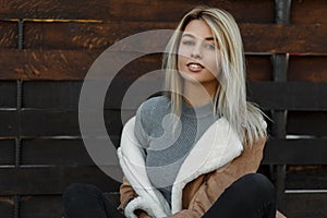 Pretty young American woman with a smile in a fashionable jacket.