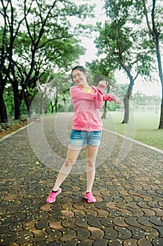 Pretty young asian excercises in the park in the morning. Fresh and healthy lifestyle for people