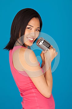 Pretty Young Asian woman with a microphone