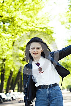 Pretty young asian woman smiling cheerful in green park on summer sunny day, lifestyle people concept