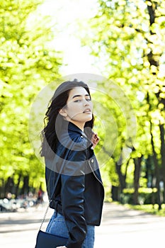 Pretty young asian woman smiling cheerful in green park on summer sunny day, lifestyle people concept