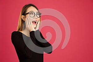 Pretty young asian woman in the studio looking shocked