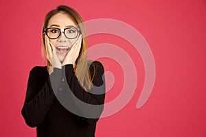 Pretty young asian woman in the studio looking shocked