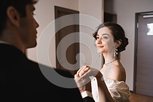pretty young bride in elegant jewelry
