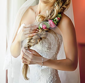 Pretty young bride with flowers in her hair