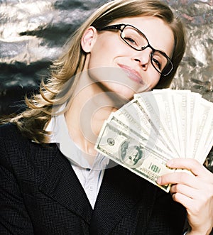 Pretty young brunette real modern woman in glasses with money ca