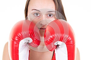 Pretty young brunette woman is boxing in gloves Isolated in white background