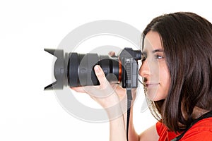 Pretty young brunette woman professional photographer with dslr camera in side view