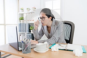 Pretty young business woman using mobile laptop