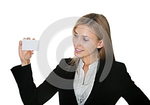 Pretty young businesswoman with a blank card