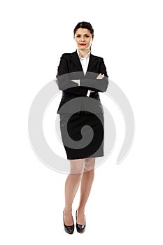 Pretty young businesswoman in full length pose