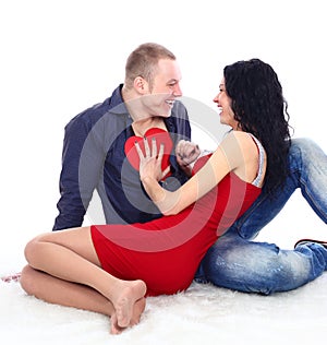 Pretty young coulple with heart symbol