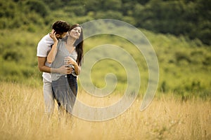 Pretty young couple in love outside in spring nature