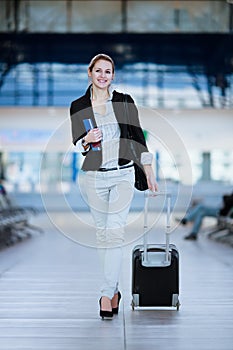 Pretty young female passenger at the airport