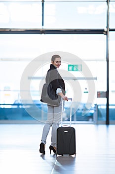 Pretty young female passenger at the airport